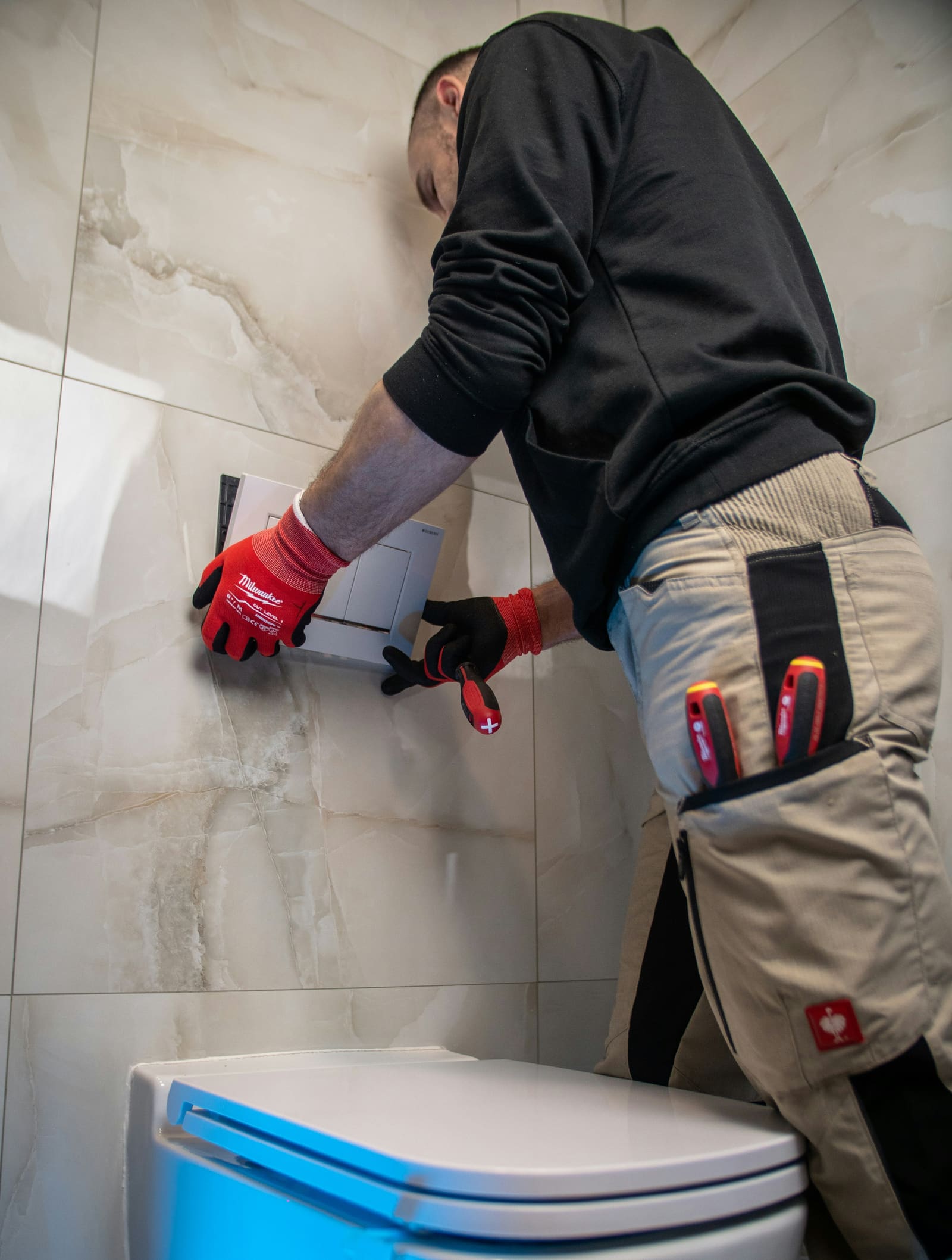 A tiler fitting a tile